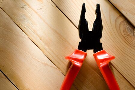 Pliers on the wooden backgroundの写真素材