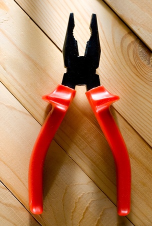 Pliers on the wooden backgroundの写真素材