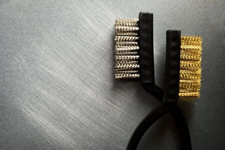 Metal brushes on steel backgroundの写真素材