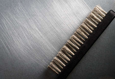 Metal brush on steel backgroundの写真素材