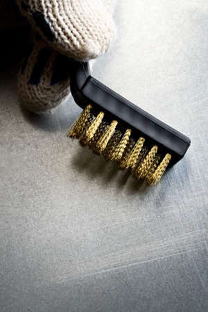Metal brush on steel backgroundの写真素材