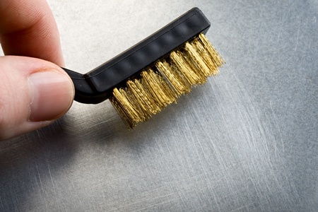 Metal brush on steel backgroundの写真素材