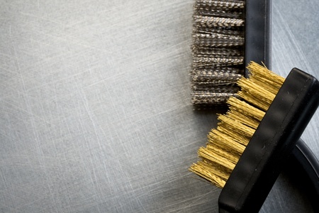 Metal brushes on steel backgroundの写真素材