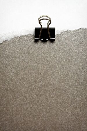 Paper clip on white and brownの写真素材