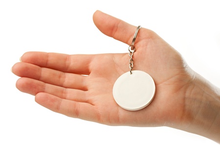 Female hand with blank badgeの写真素材