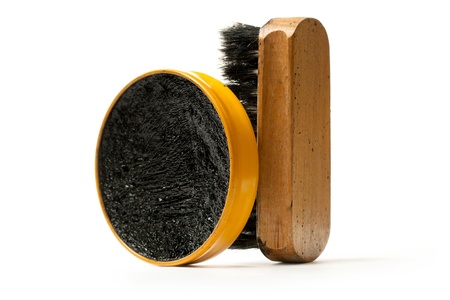 Shoe polish and brush on white