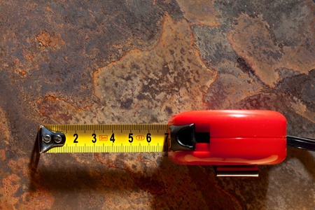 Tape measure on the rusty backgroundの写真素材