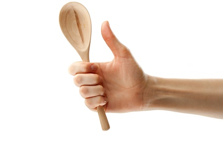 Wooden spoon in female handの写真素材