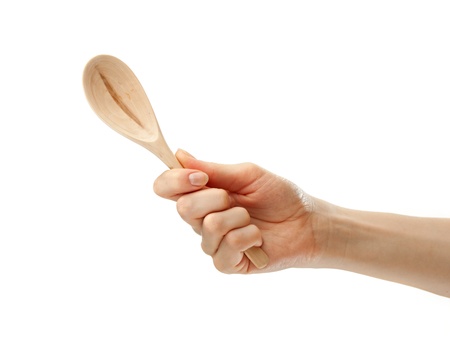 Wooden spoon in female handの写真素材