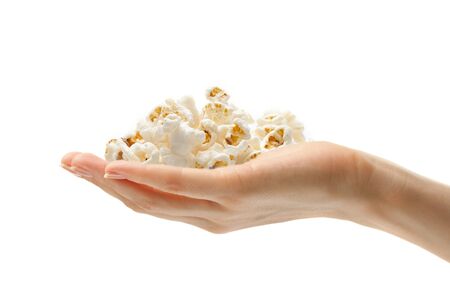 Female hand with popcornの写真素材