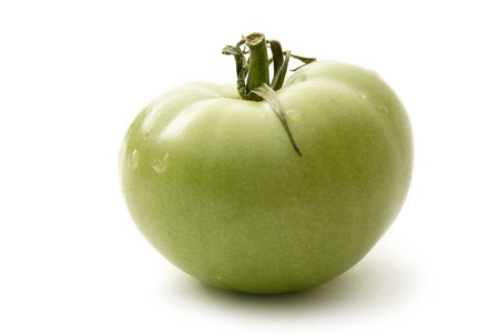 Green tomato on white background の写真素材