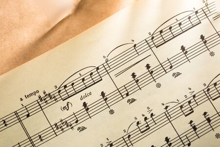 Music notes on paper backgroundの写真素材