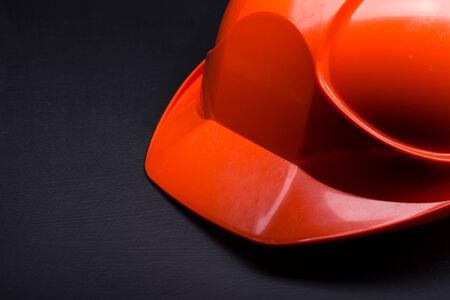 Red safety helmet on blackの写真素材