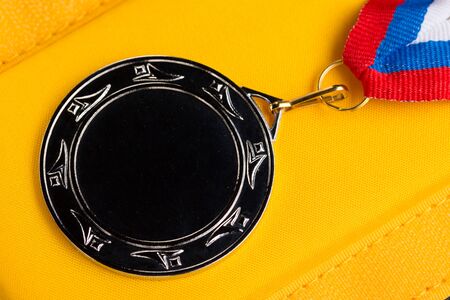 Metal medal with tricolor ribbonの写真素材