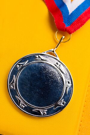 Metal medal with tricolor ribbonの写真素材
