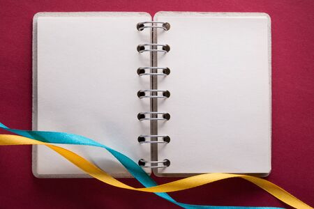 Open notebook with ribbonsの写真素材