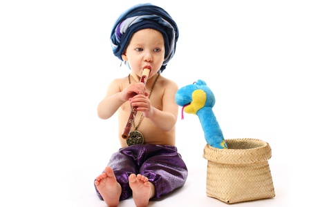 Charmer boy with pipe and snakeの写真素材