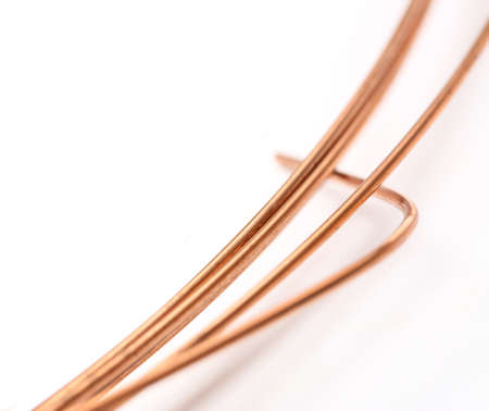 Uncoated wire strings on whiteの写真素材