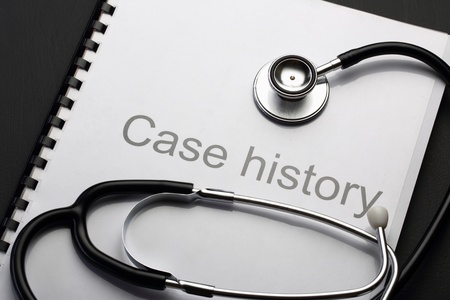 Case history and stethoscope on blackの写真素材