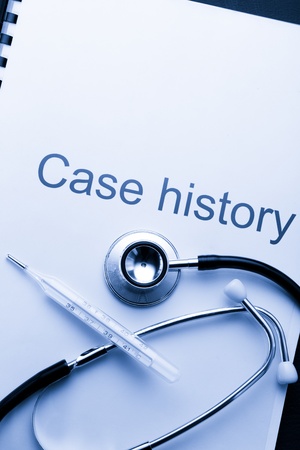 Case history, stethoscope and thermometer on blackの写真素材
