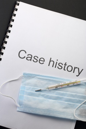 Case history, mask and thermometer on blackの写真素材