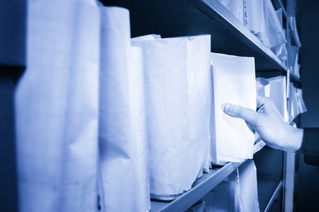 Paper documents stacked in archiveの写真素材