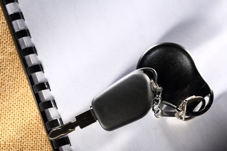 Blank notebook and car keyの写真素材