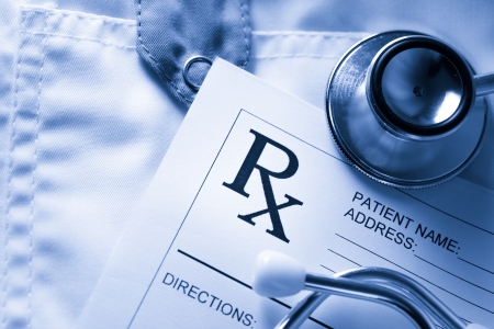 Stethoscope and patient list on doctor's smockの写真素材