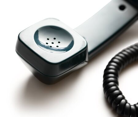 Old-fashioned green telephone receiverの写真素材