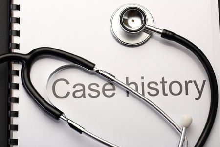 Case history and stethoscope on blackの写真素材