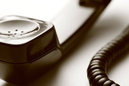 Old-fashioned brown telephone receiver の写真素材