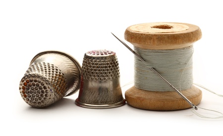 Sewing thimbles, bobbin and needle