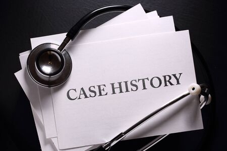 Case history and stethoscope on black の写真素材