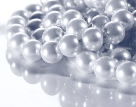 White pearl on reflective surface の写真素材