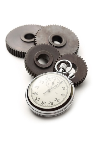 Four steel cogwheels and stopwatchの写真素材