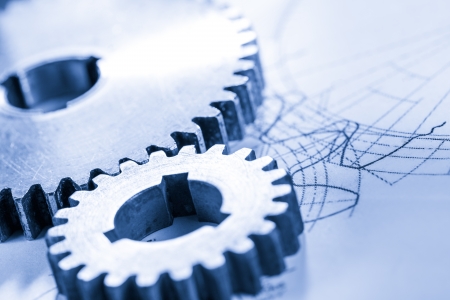 Steel cogwheels in connection on drawingの写真素材