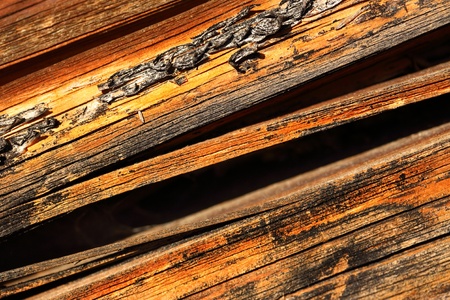 Wooden cracked textured material backgroundの写真素材