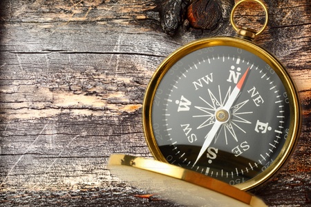 Compass on cracked wooden backgroundの写真素材