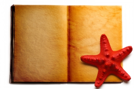 Open book and red seastarの写真素材