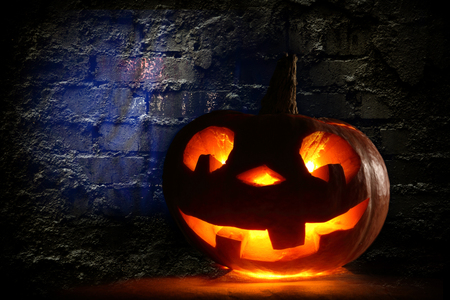 Funny halloween pumpkin on the wallの写真素材