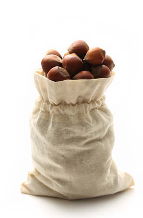 Fresh hazelnuts in a sackの写真素材