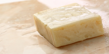 Bar of soap on tileの写真素材