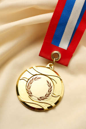 Metal medal on silk wrinkled cloth