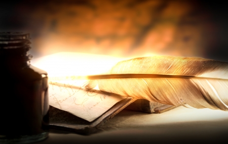 Old book with feather and inkpot の写真素材