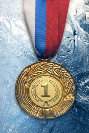Metal medal on frozen backgroundの写真素材