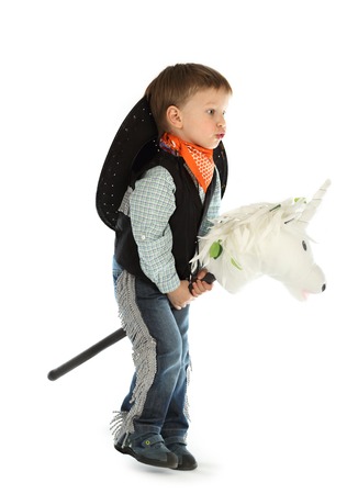 Cowboy child riding white unicornの写真素材