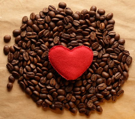Brown coffee beans with heartの写真素材