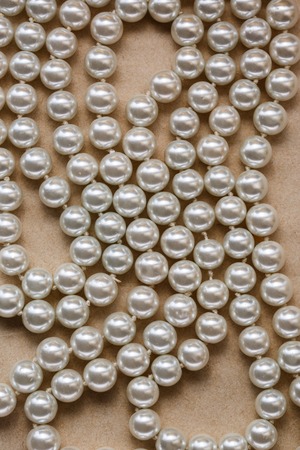 White pearl necklace as background