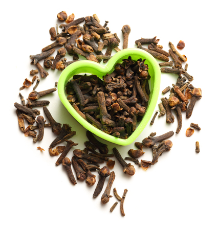 Cloves seeds in green heart formの写真素材