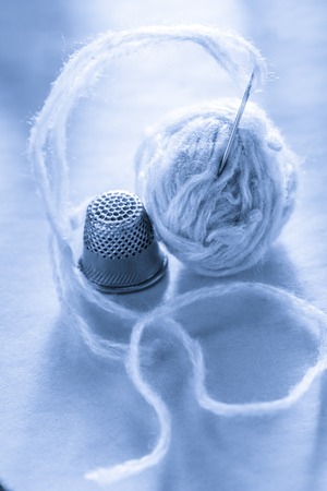 Sewing thimble, needle and thread clewの写真素材